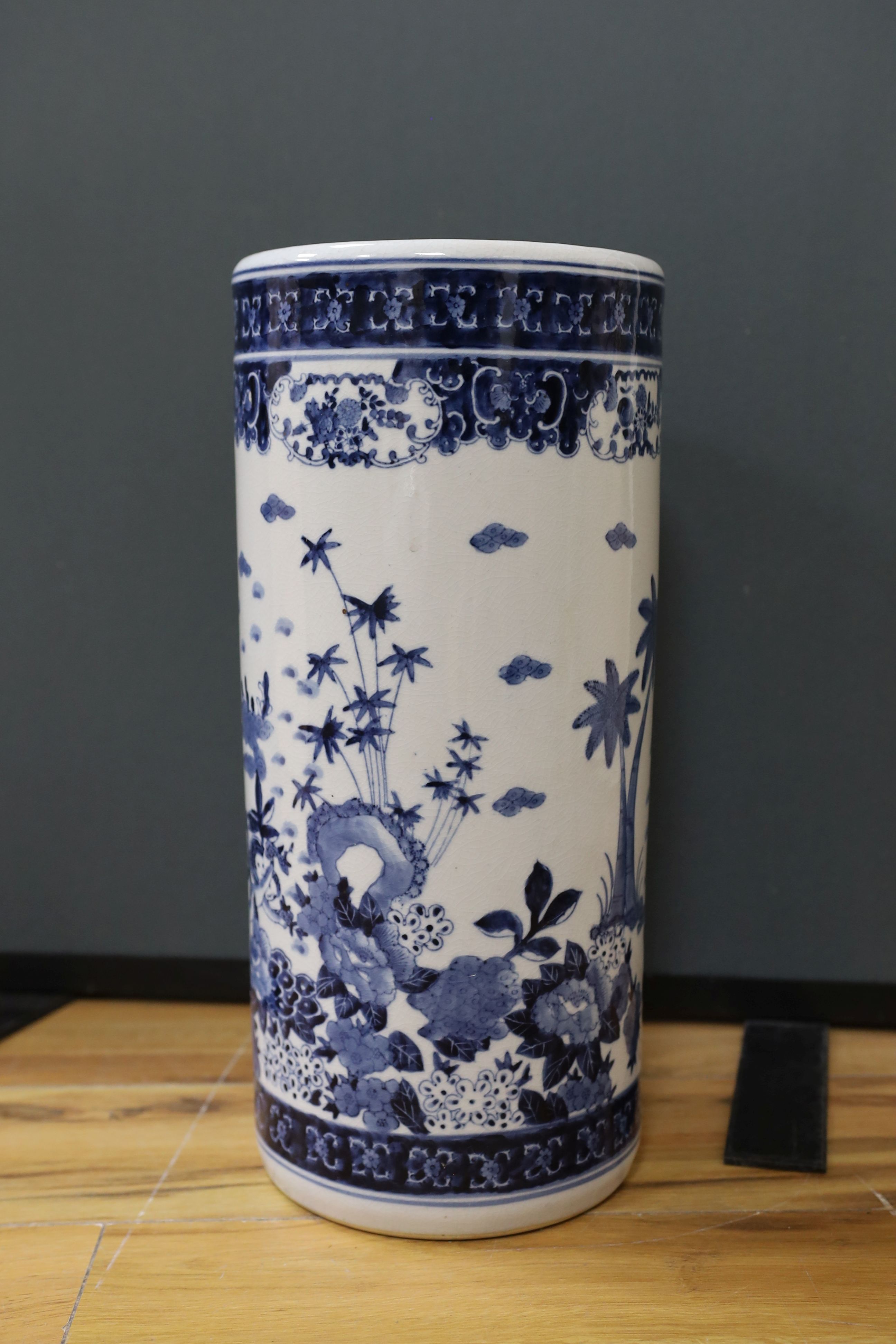 A Chinese blue and white cylindrical stick and umbrella stand, 44cm